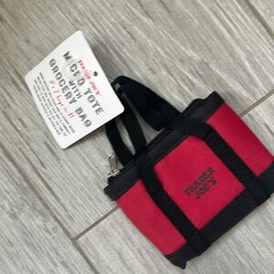 NWT. Trader Joe’s canvas micro tote with grocery bag.  Red. Black. New.